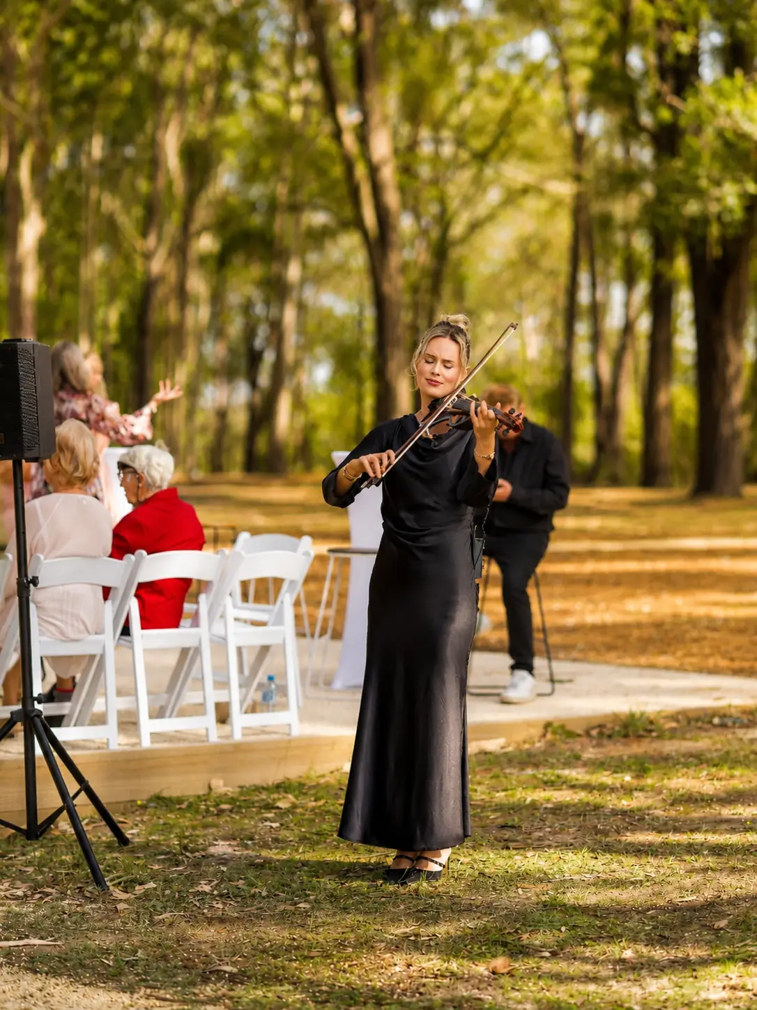 Live violinist performing during an outdoor wedding ceremony at Adeline Estate, a private Hunter Valley venue