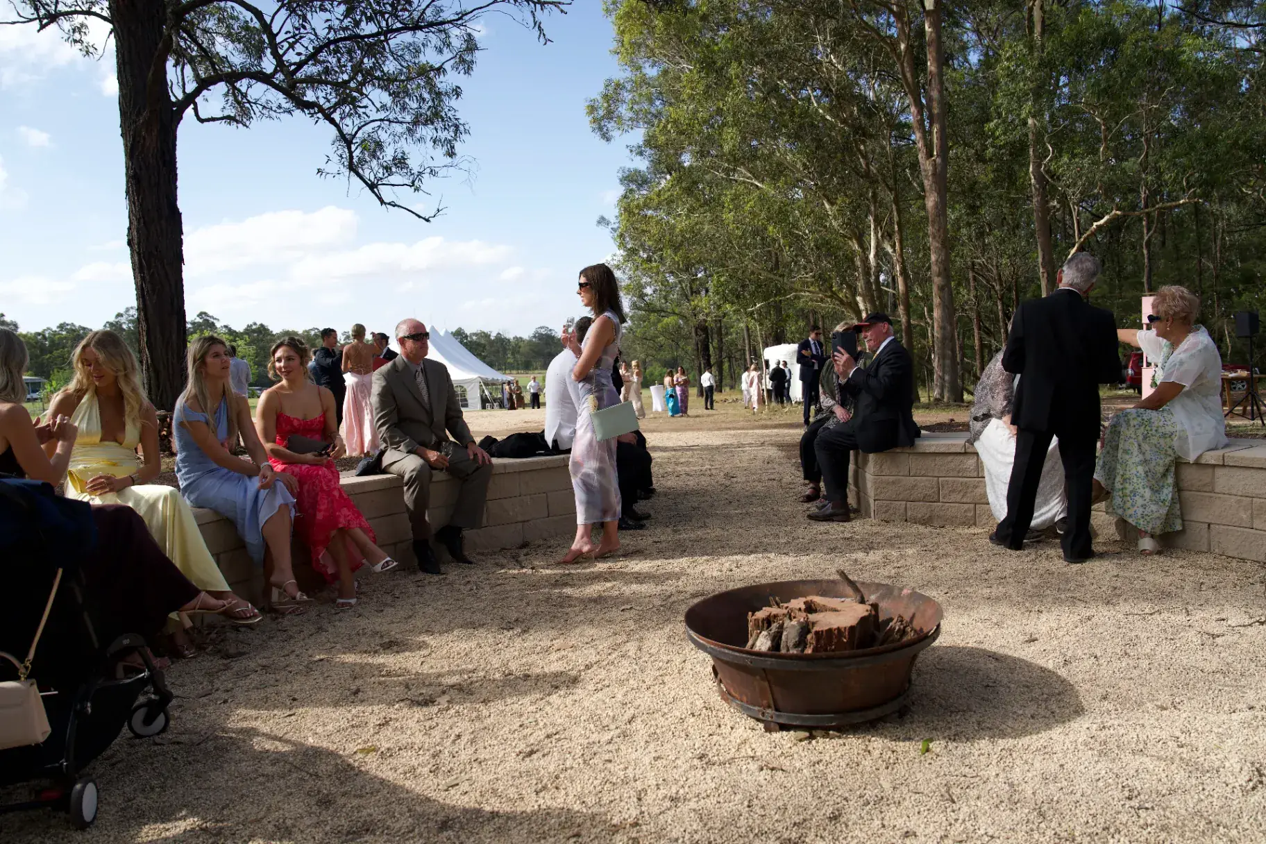 Guests gathering around the fire pit