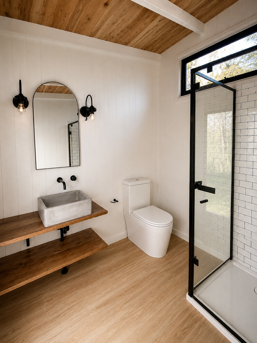 The interior of the bathhouse with tiled shower and basin