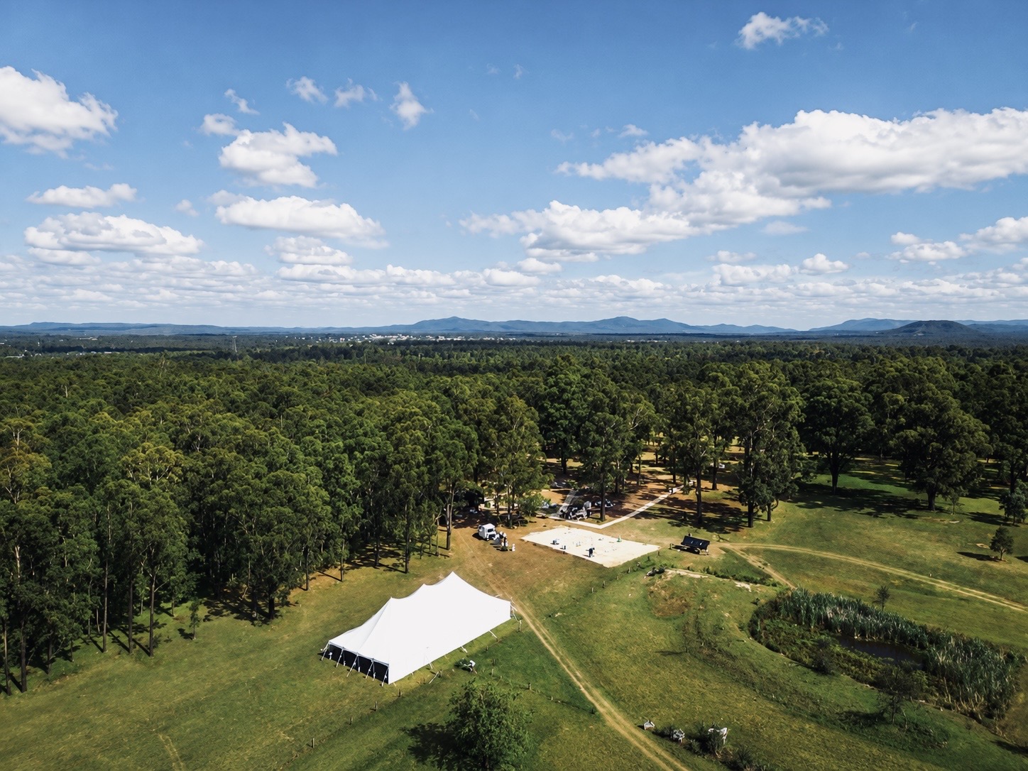 Aerial view of the estate paddocks and homestead in summer