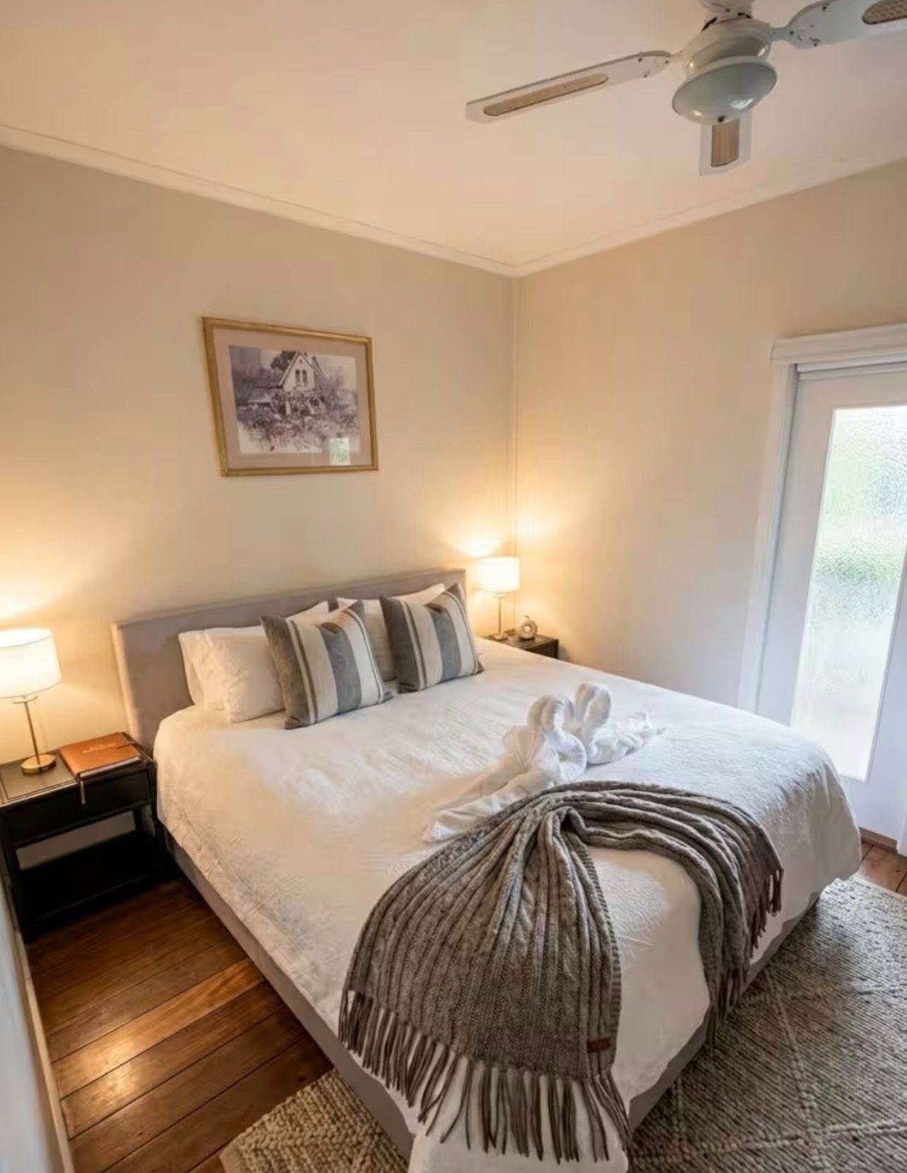A bedroom in the homestead with morning light through the window