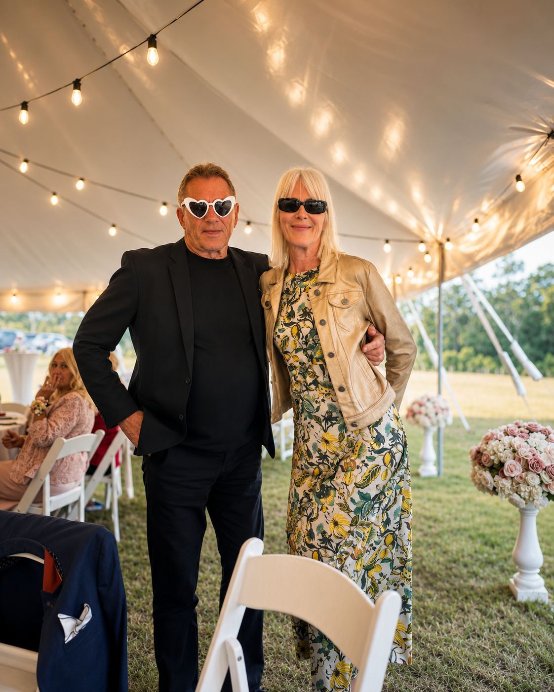 Guests in sunglasses relaxing outside a bell tent